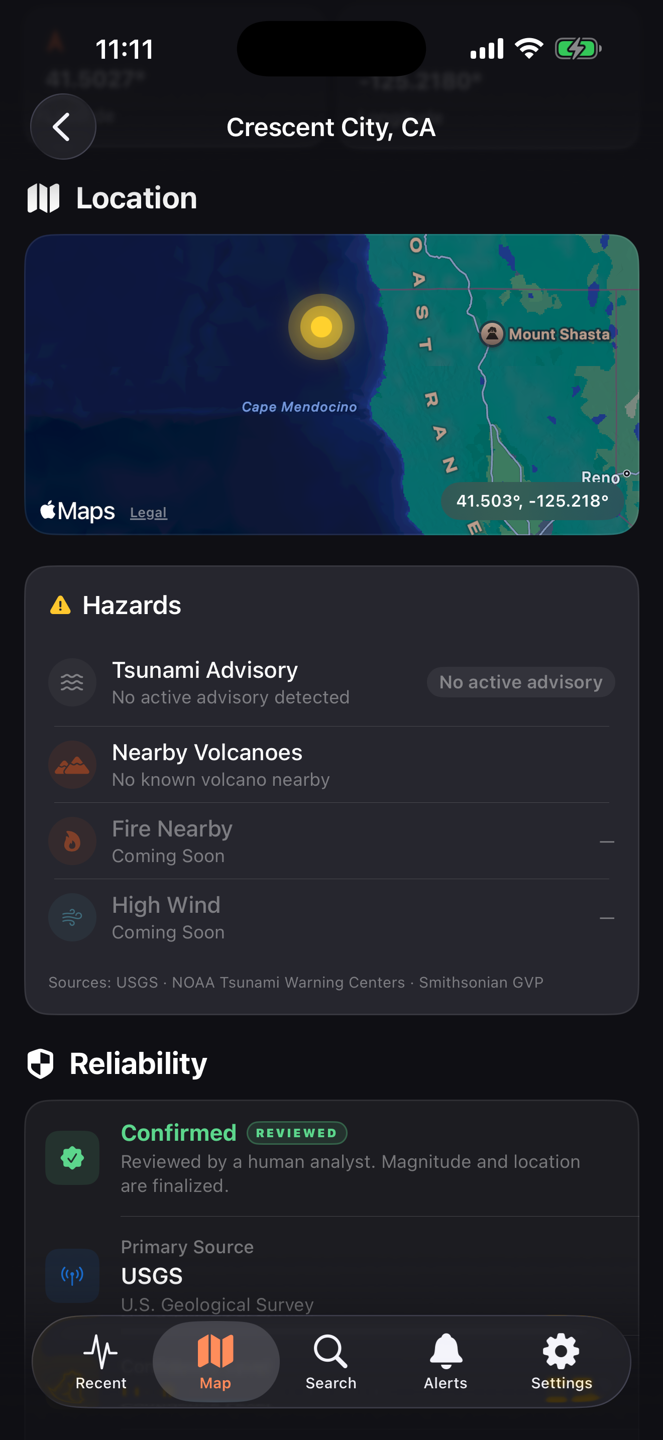Event location map and hazards panel listing tsunami advisory, nearby volcanoes, fire, and high wind